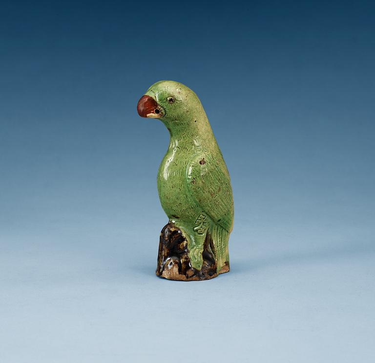 A green glazed figure of a bird, late Qing dynasty.