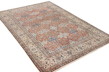 A semi-antique/old Nain carpet, part silk, c. 343 x 230 cm.
