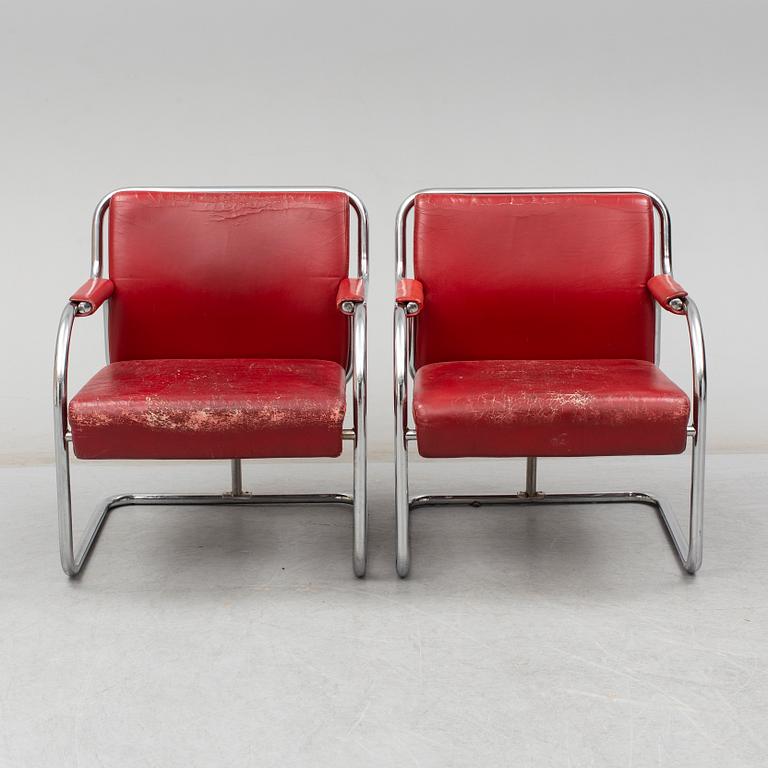 A pair of 1920s armchairs.