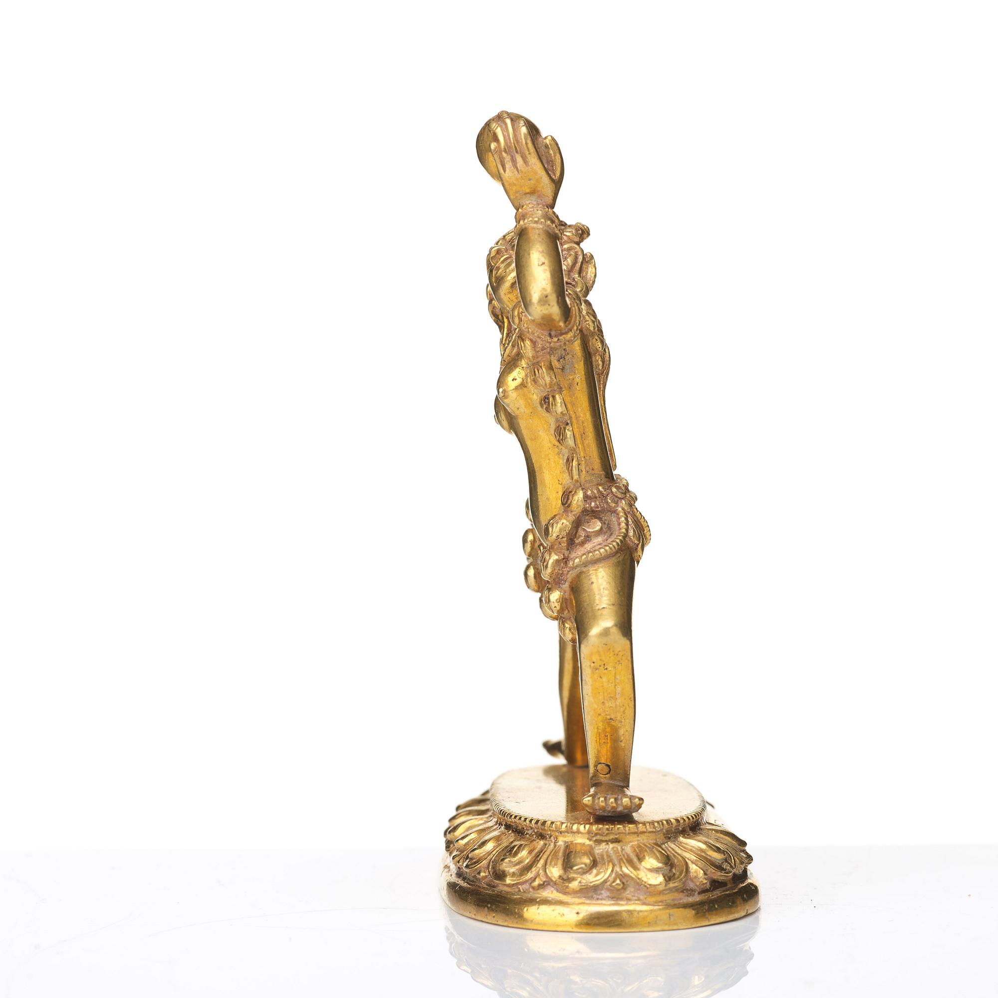 A gilt bronze figure of Dakini, Tibeto-Chinese, 19th Century.