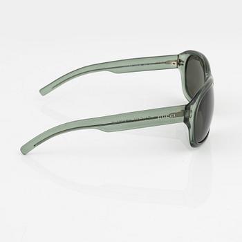 Gucci, a pair of green sunglasses.