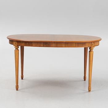 A Gustavian style dining table with two armchairs and four chairs, late 20th century.
