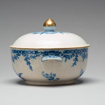 A blue and white armorial tureen with cover, and stand, Qing dynasty, 18th Century.