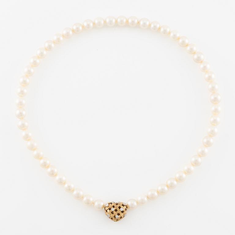 Ole Lynggard lås i form av ett hjärta 18K guld med runda briljantslipade diamanter.