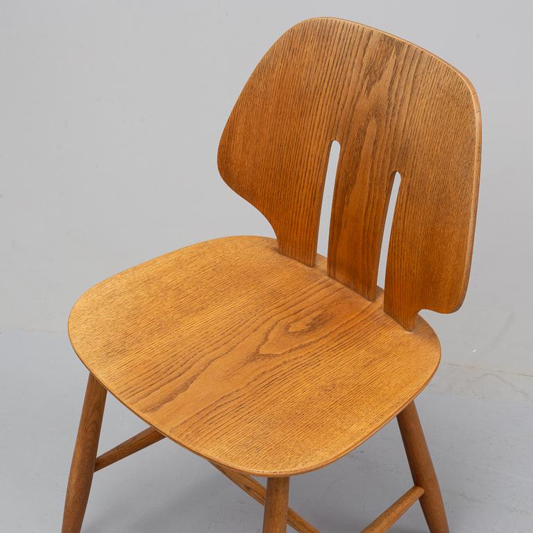 Three 'J 67' oak chairs by Ejvind A. Johansson, 1960's.