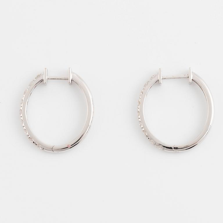 Brilliant cut diamond hoop earrings.