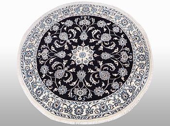A rug, Nain, part silk, diameter ca 140 cm.