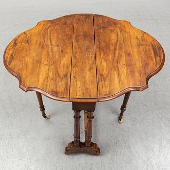 A 19th Century drop leaf table.