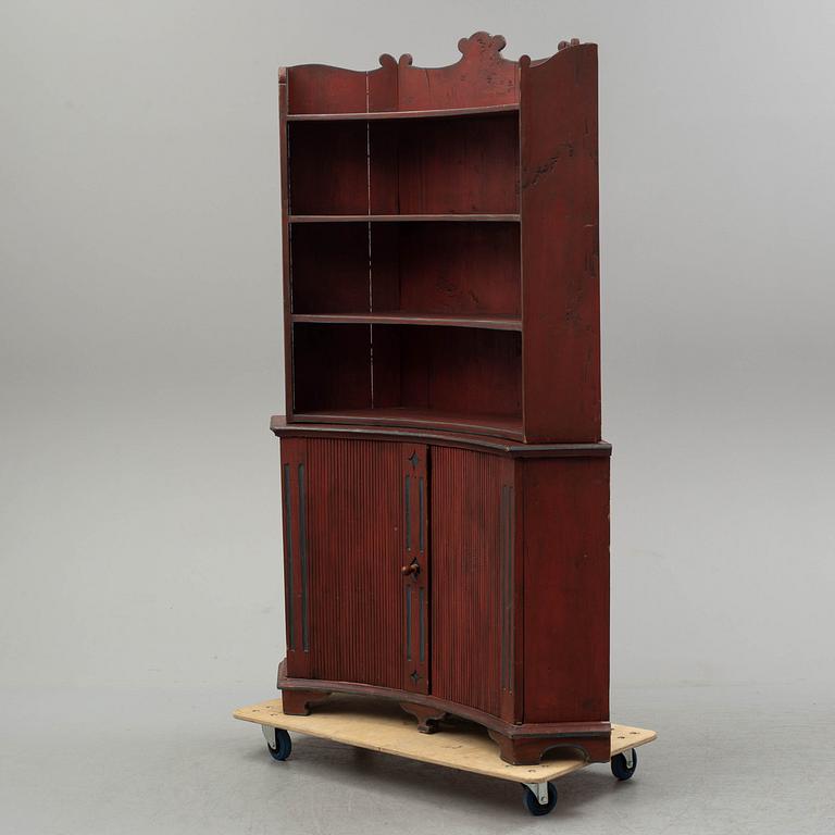 A 19th century corner cupboard.