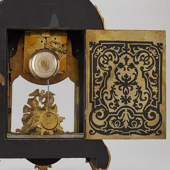 A boulle style table clock, circa 1900.