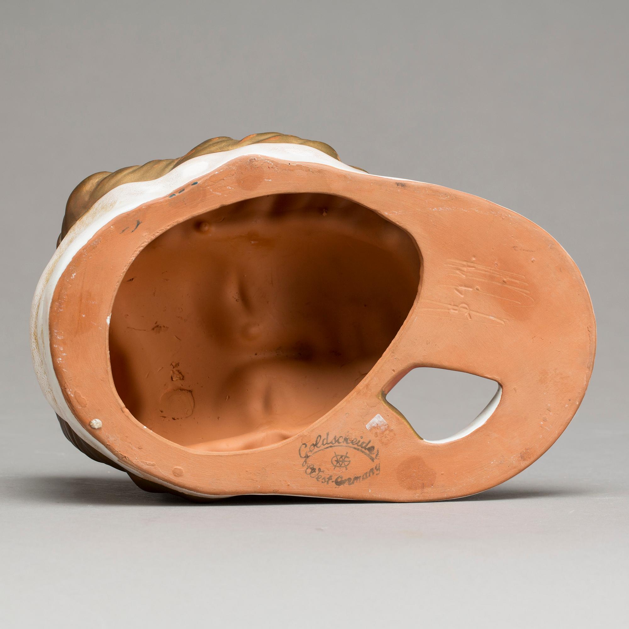 An Adolf Prischl terracotta wall mask for Goldscheider, mid 1900.