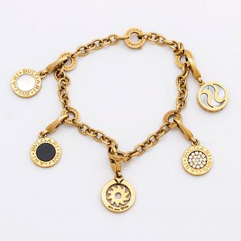 BVLGARI BRACELET w 5 charms (detachable), 18K gold and whitegold, onyx, mother-of-pearl, brilliant-cut diamonds 0,20 ct.