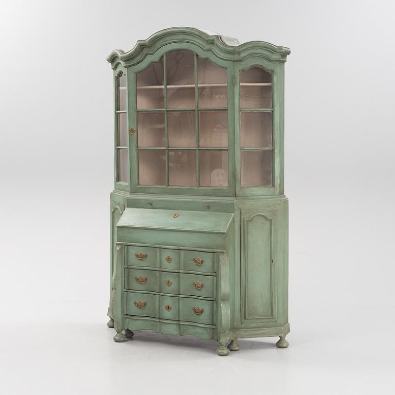 A Rococo cabinet with vitrine top.