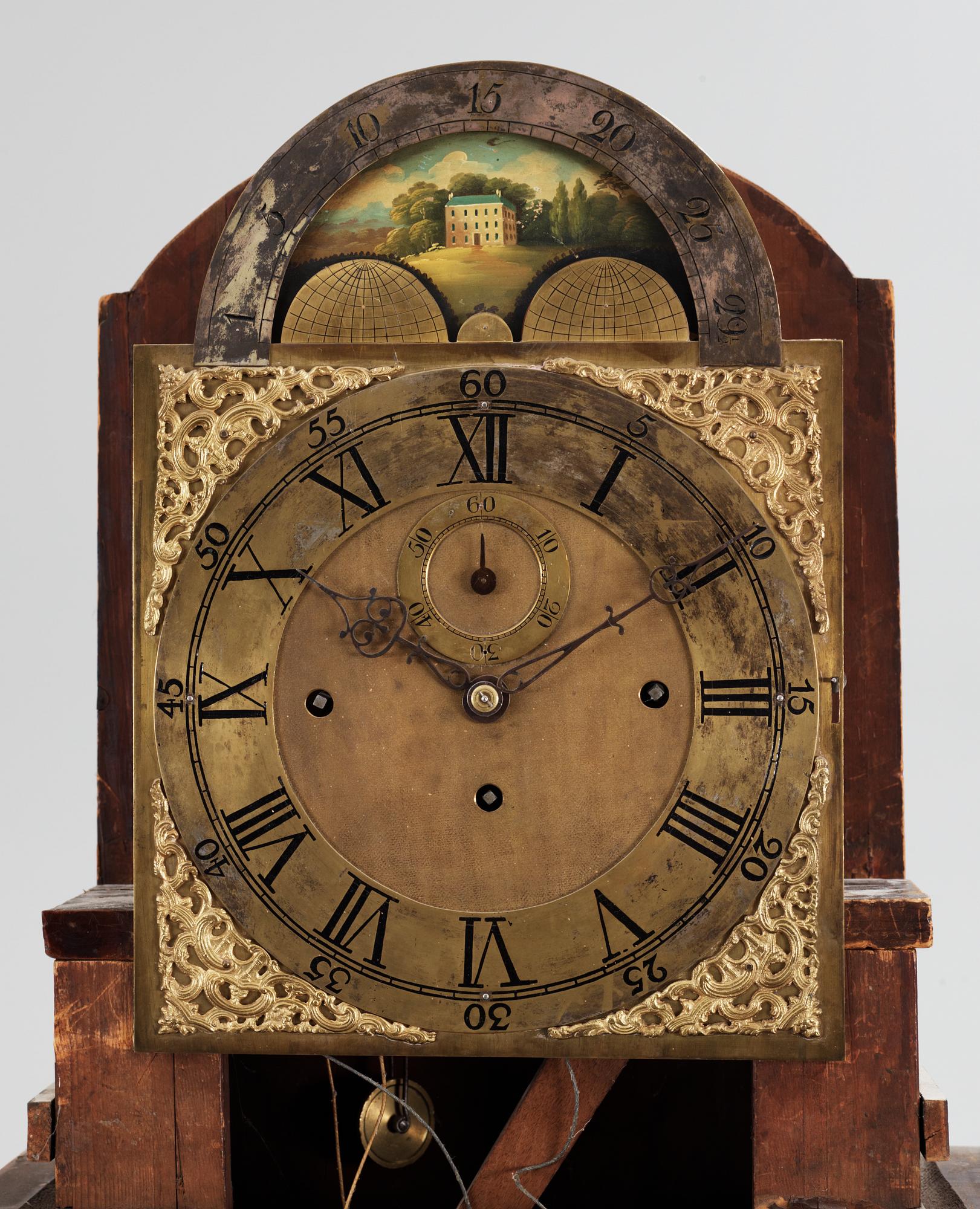 An English circa 1800 mahogany veneer longcase clock.