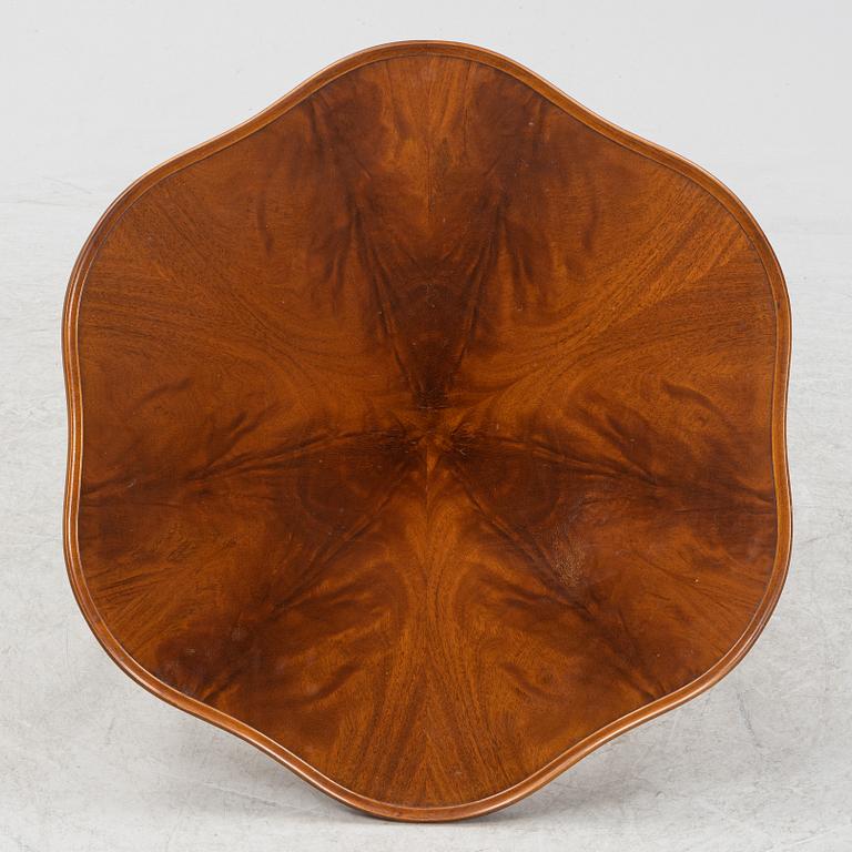 A 1940s mahogany coffee table.