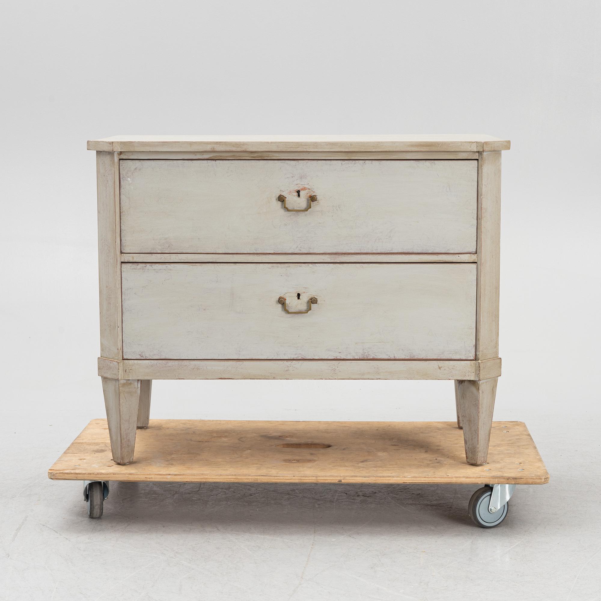 A chest of drawers, circa 1900.