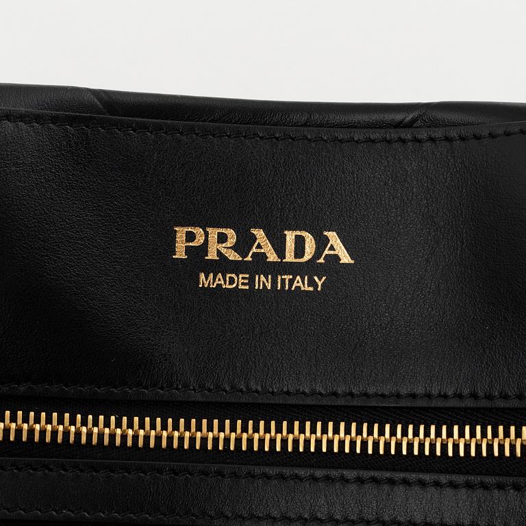 Prada, a black leather bag.