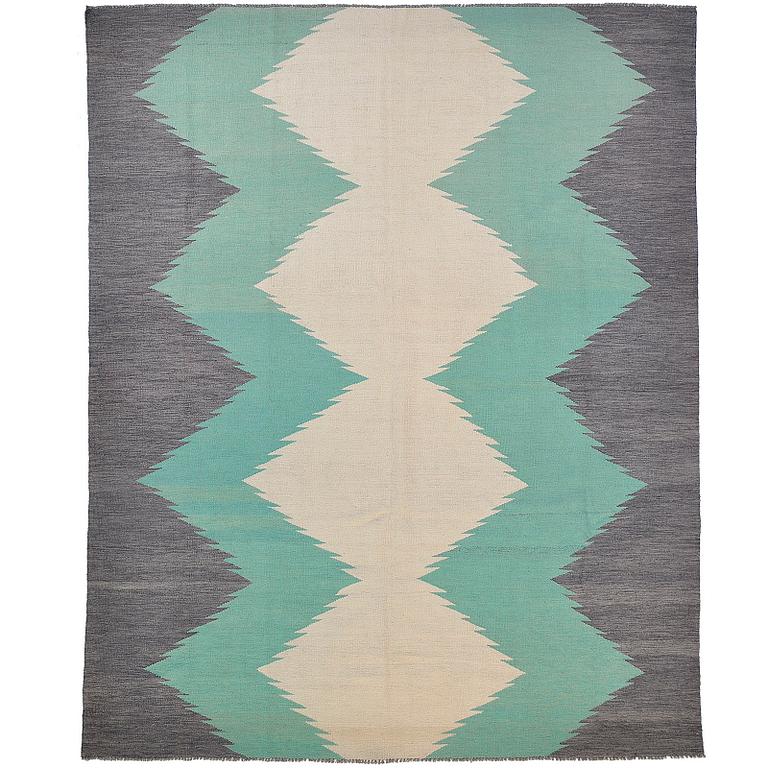 A kilim carpet, ca 303 x 250 cm.
