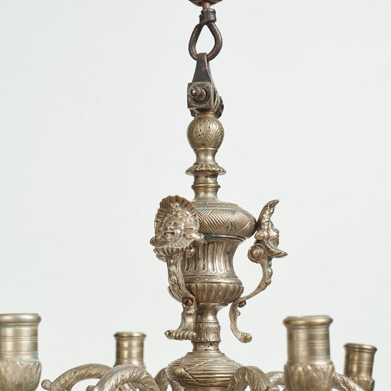 A Swedish silvered brass presumably late Baroque chandelier in the style of Jean Berain.