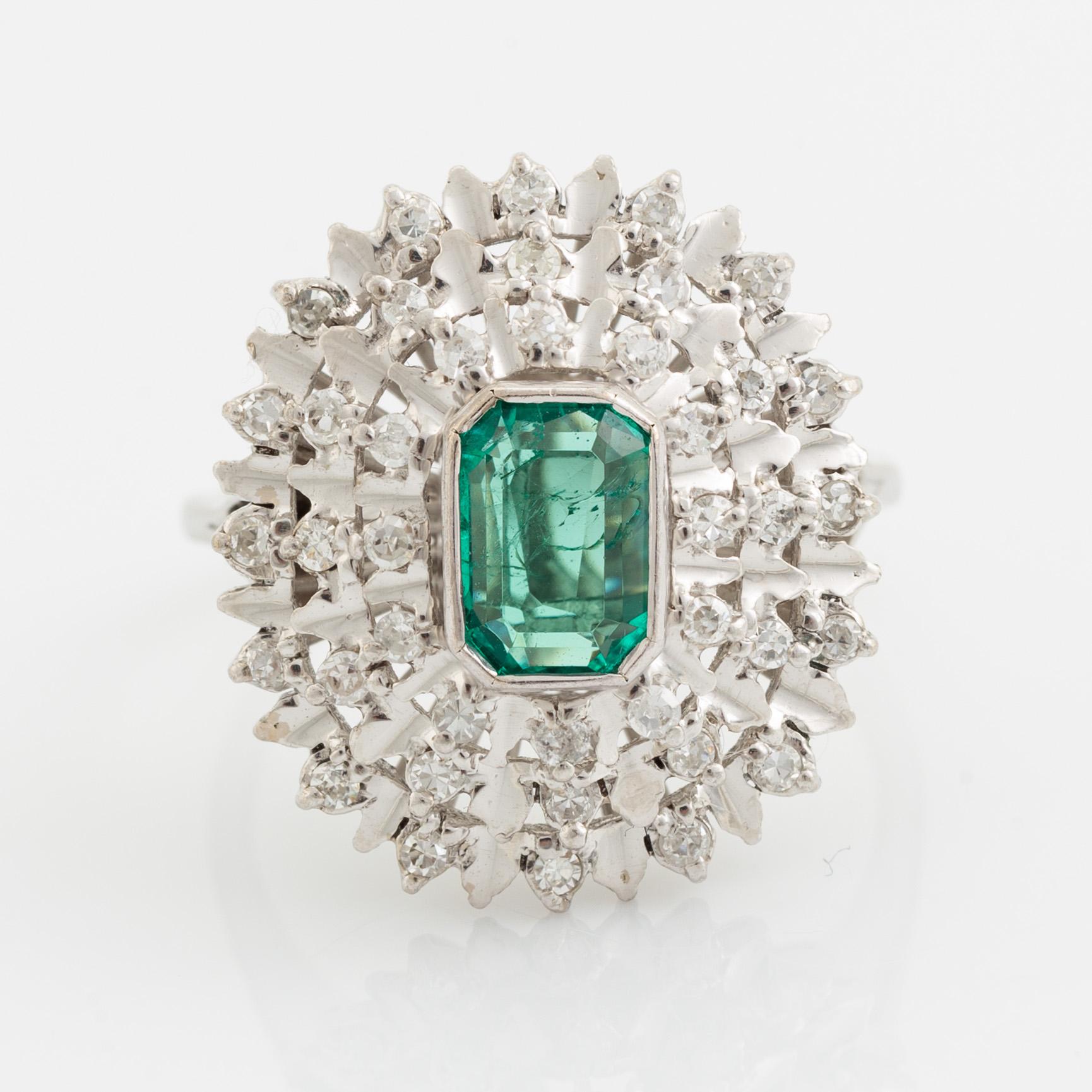 Emerald-cut emerald and eight cut diamond ring.