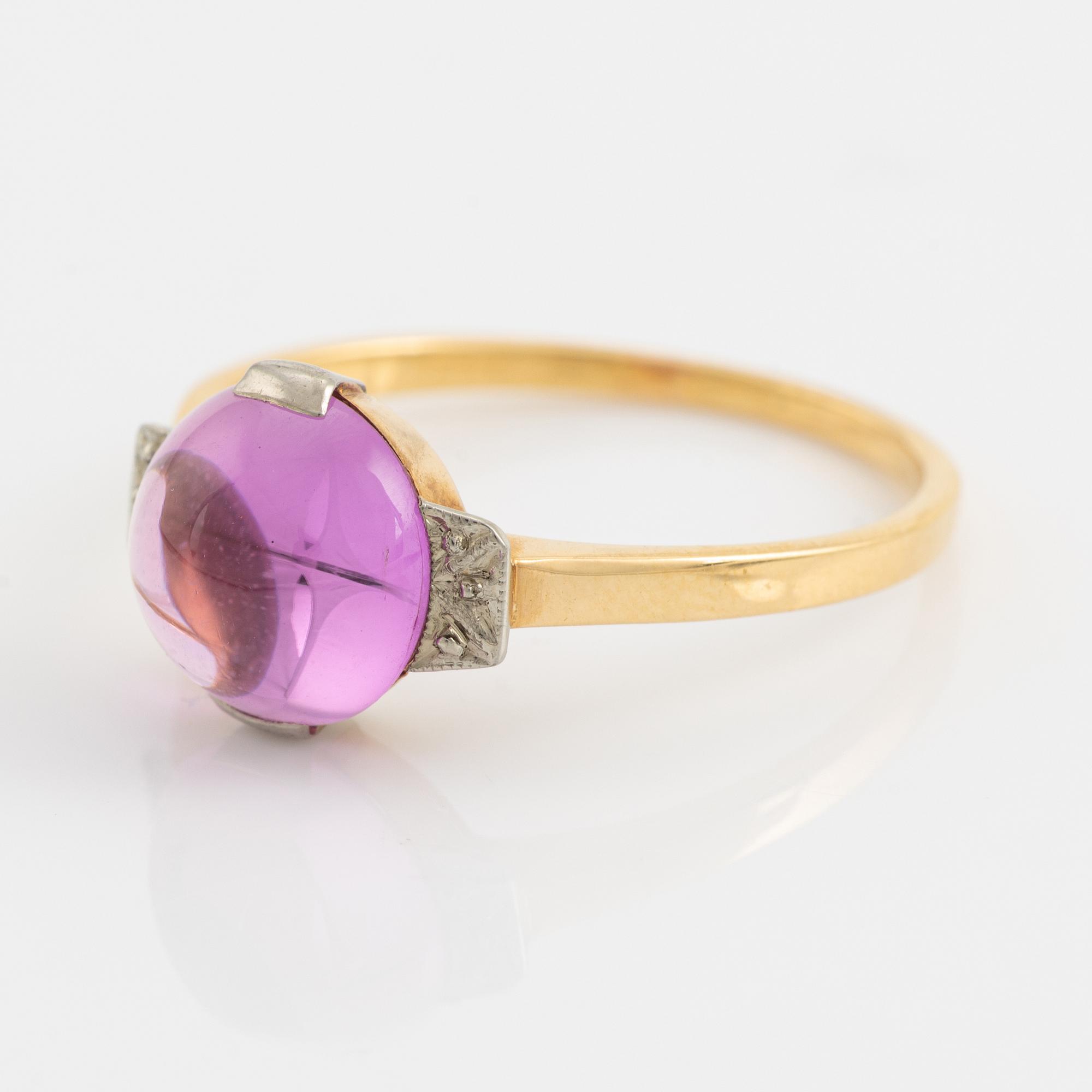 18K gold and cabochon cut syntehtic pink sapphire.