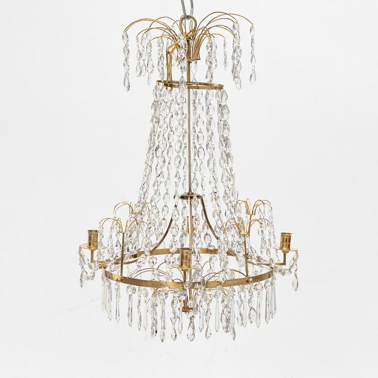 A Gustavian four-branch gilt-brass chandelier, Stockholm, late 18th century.