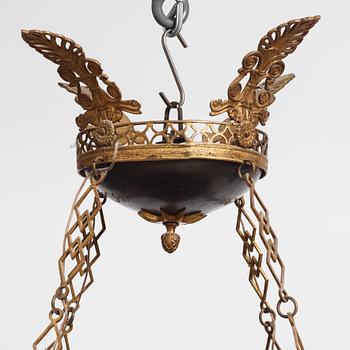 A presumably Russian Empire gilt and patinated bronze nine-branch chandelier, 19th century.