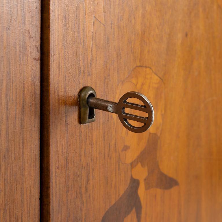 Erik Matsson, a walnut-veneered cabinet, Mjölby Intarsia, 1940's/50's.