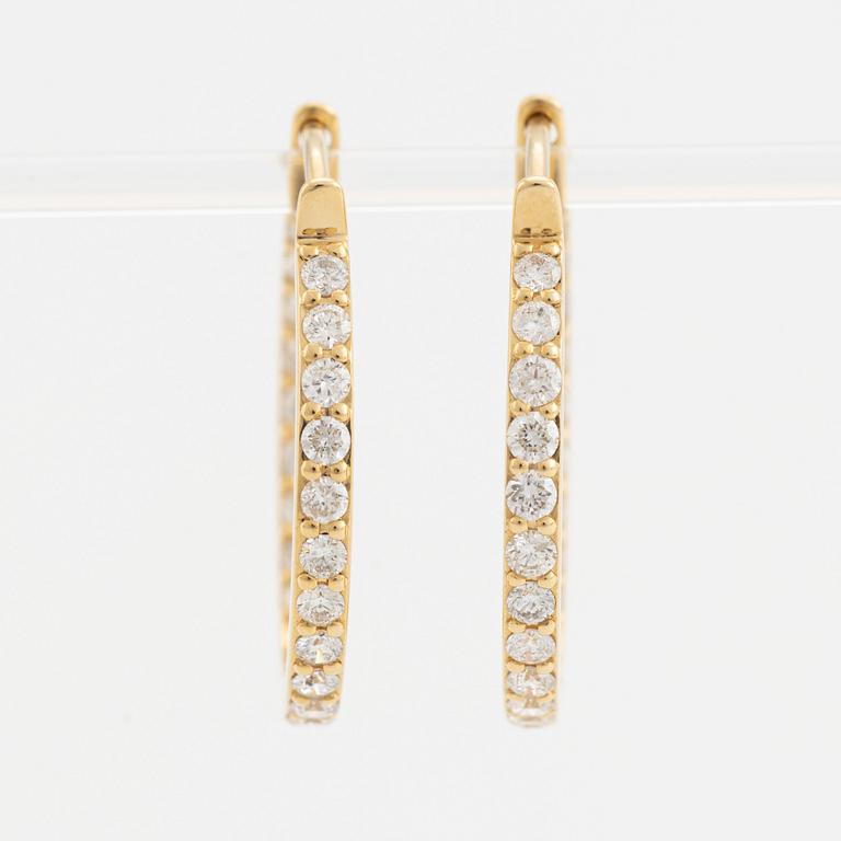 Brilliant cut diamond hoop earrings.