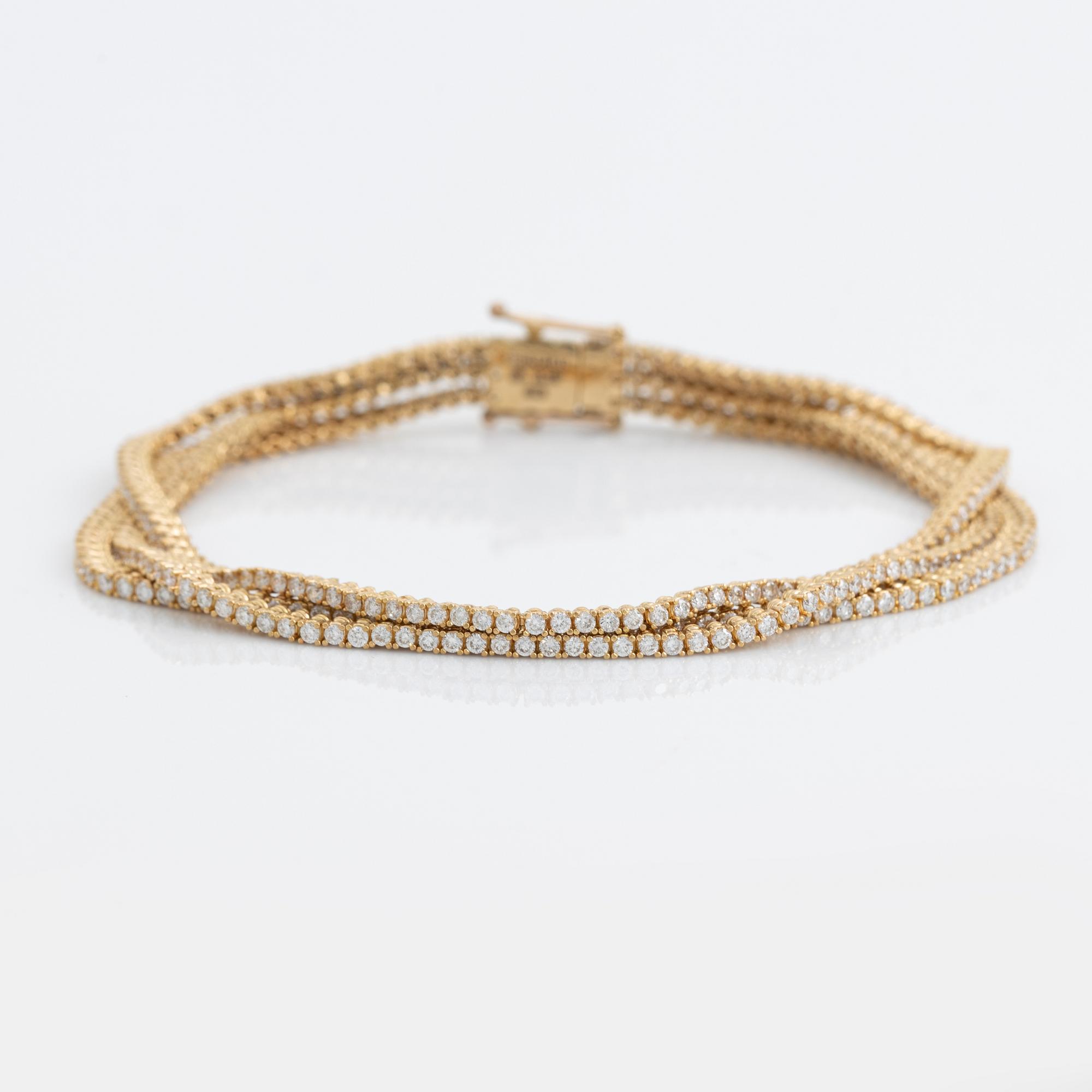 Brilliant cut diamond three strand bracelet.