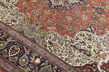 A Tabriz carpet, so called 40 Raj, c. 396 x 296 cm.