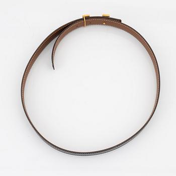 Hermès, A reversible leather and gold hardware 'Constance' belt from 1997.