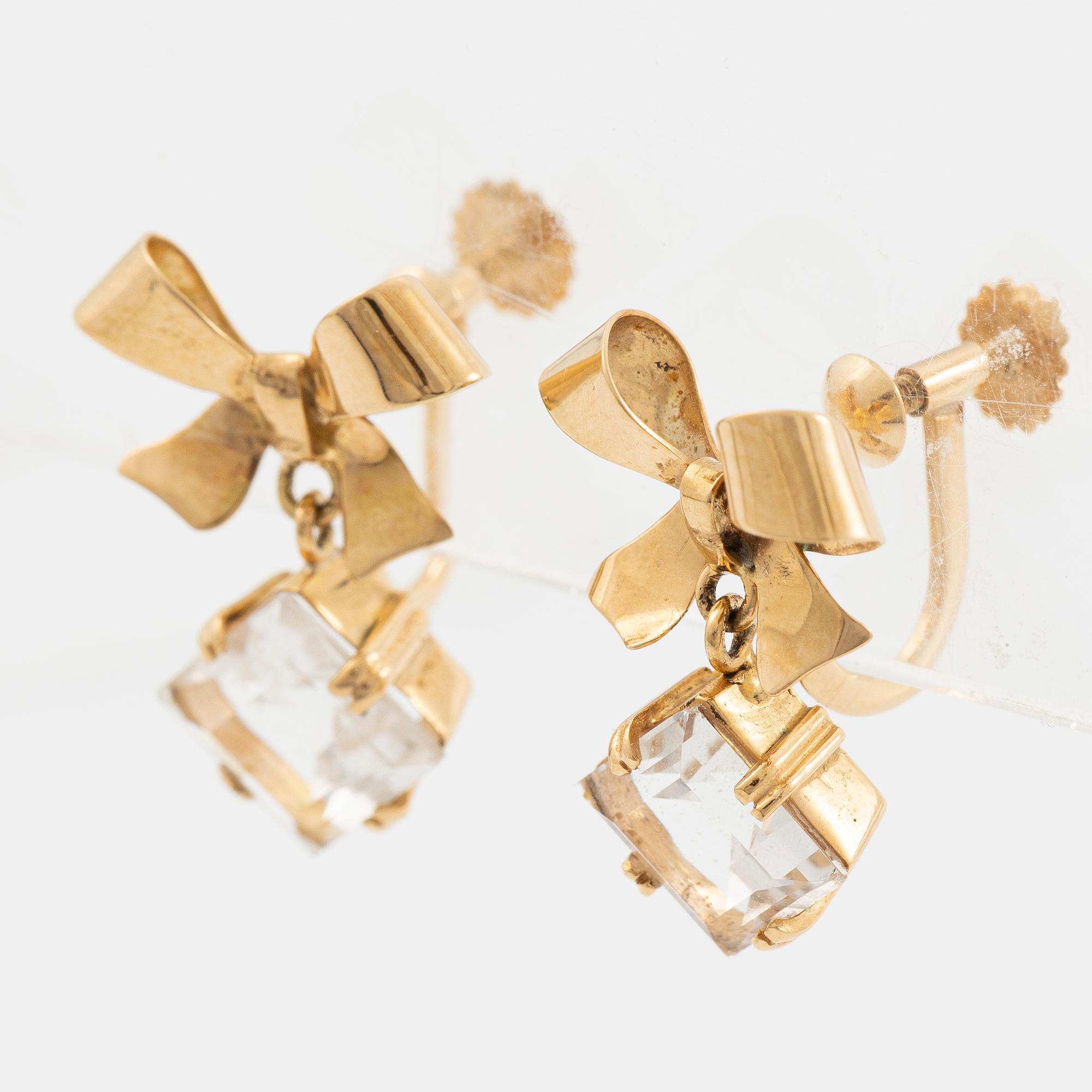 A pair of 18K gold earrings with faceted rock crystal.