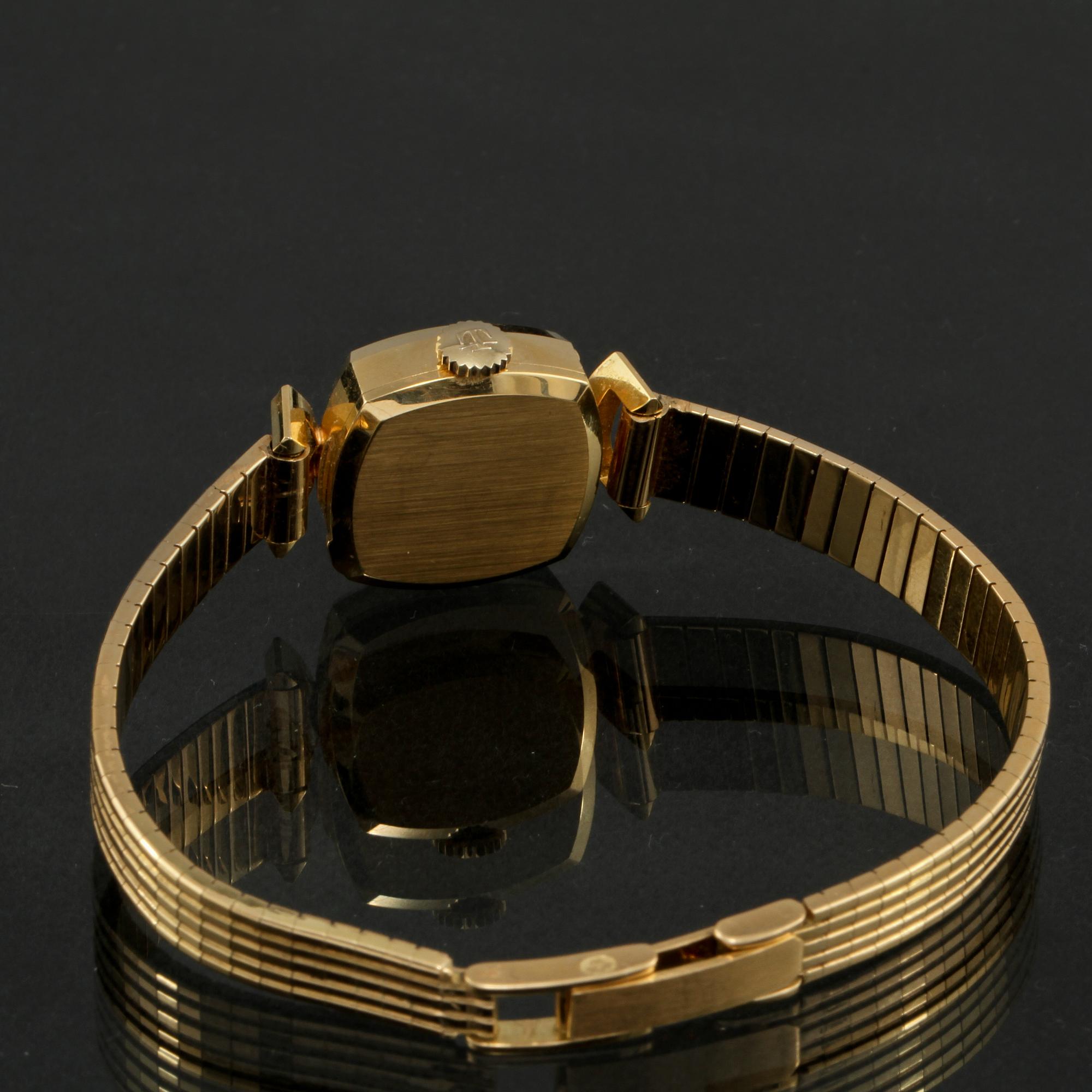 DAMARMBANDSUR, 18k guld, Tissot. Vikt 27 g.