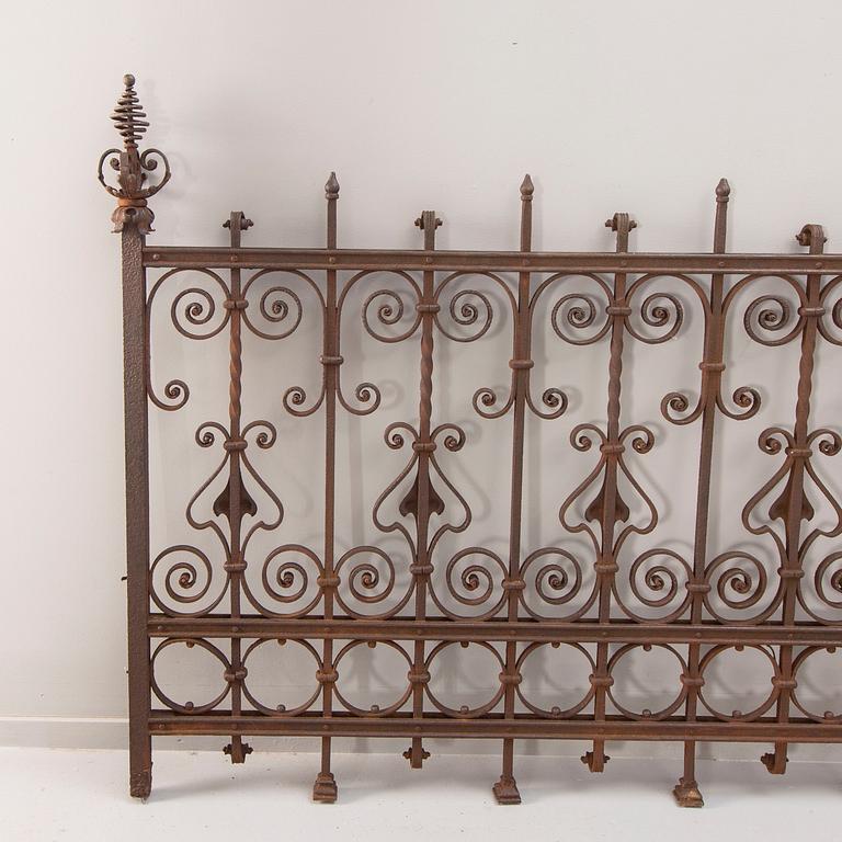 A cast iron fence around 1900.