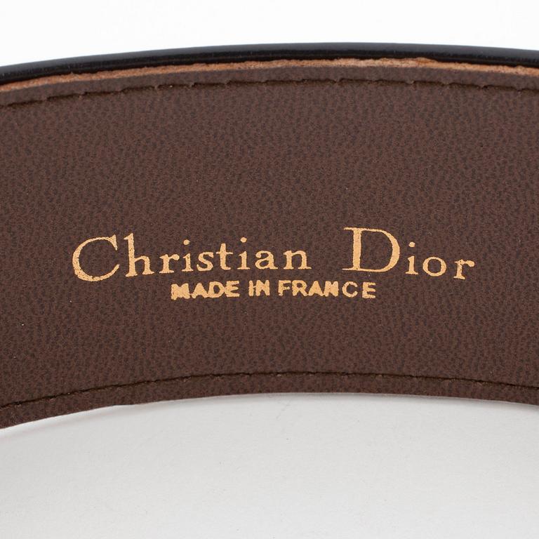 CHRISTIAN DIOR, a black leather belt.