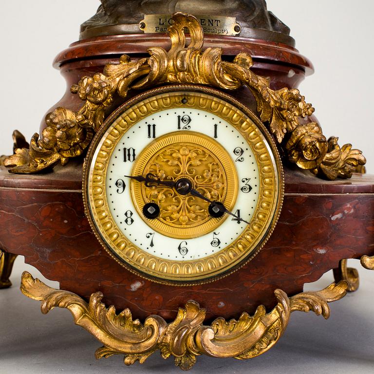 A mantel clock with sculpture "L'occident" after Émile Bruchon from the turn of the century 1800/1900.