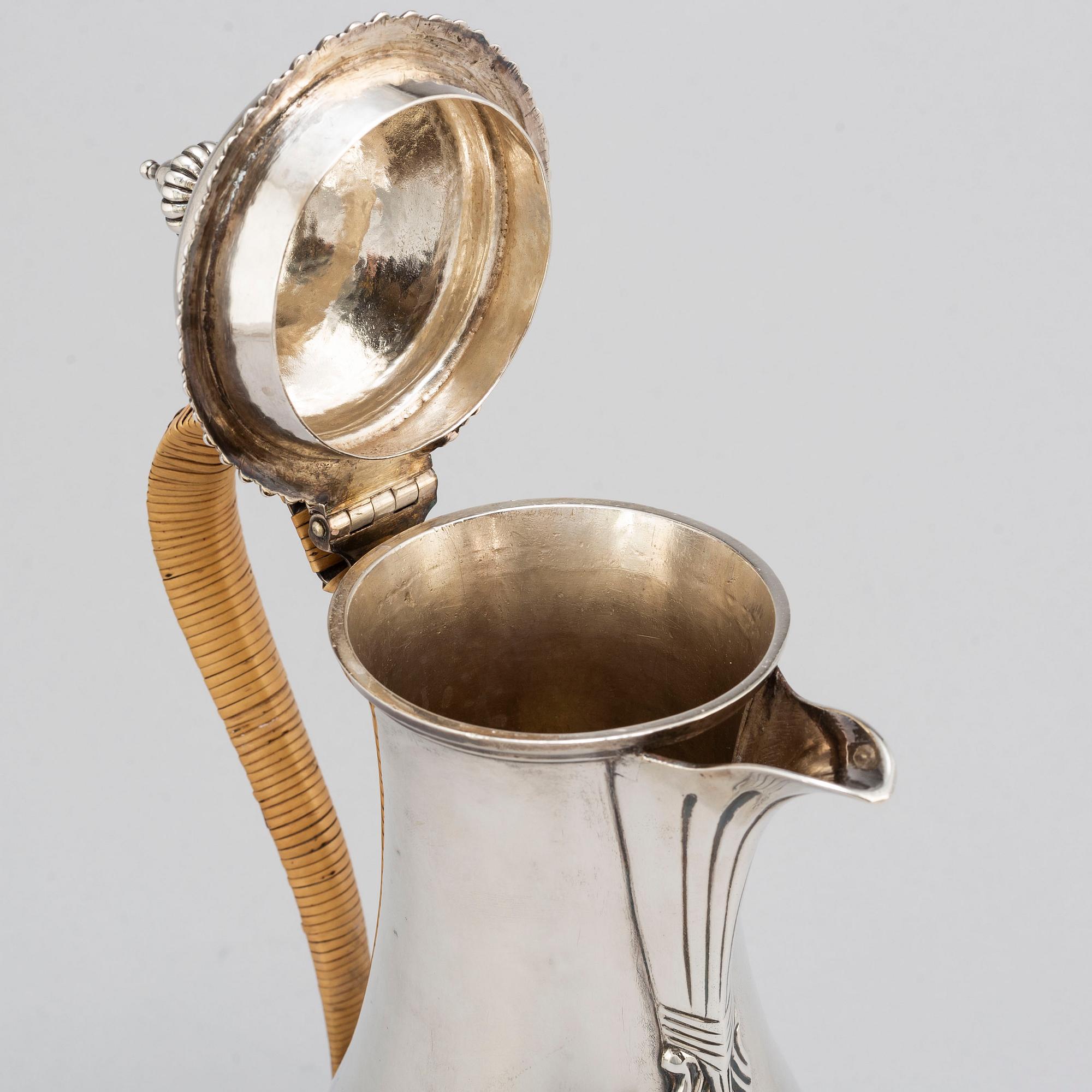 An English 18th century silver wine jug, mark of Augustin Le Sage, London 1770.