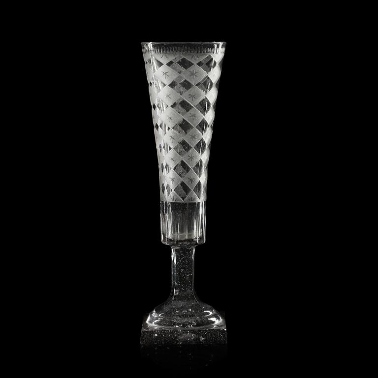 A set of eight engraved and cut champagne flutes, early 19th Century.