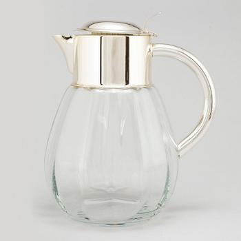 A glass and metal jug, second half of the 20th century, purchased from Firma Svenskt Tenn.