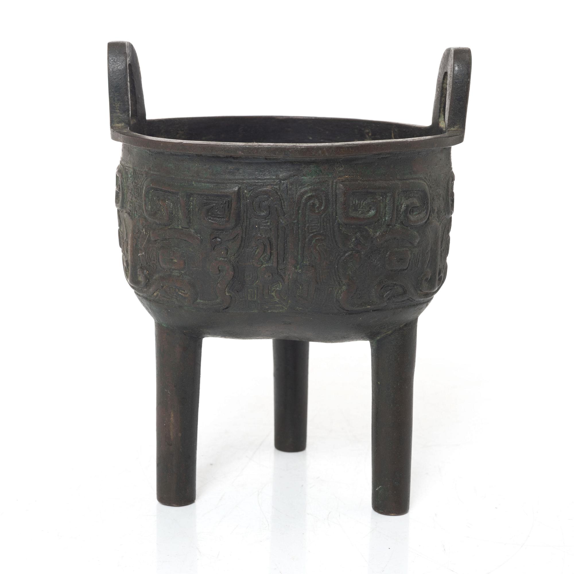 A Chinese tripod bronze censer, Ming style, Qing dynasty (1644-1912).