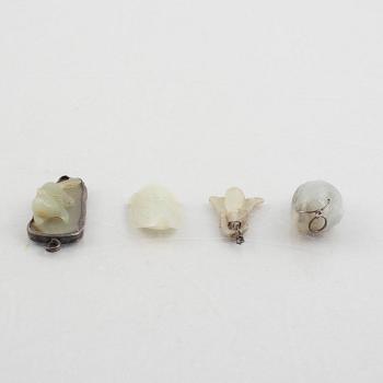 A group of eight Chinese stone charms / pendants, 20th century.
