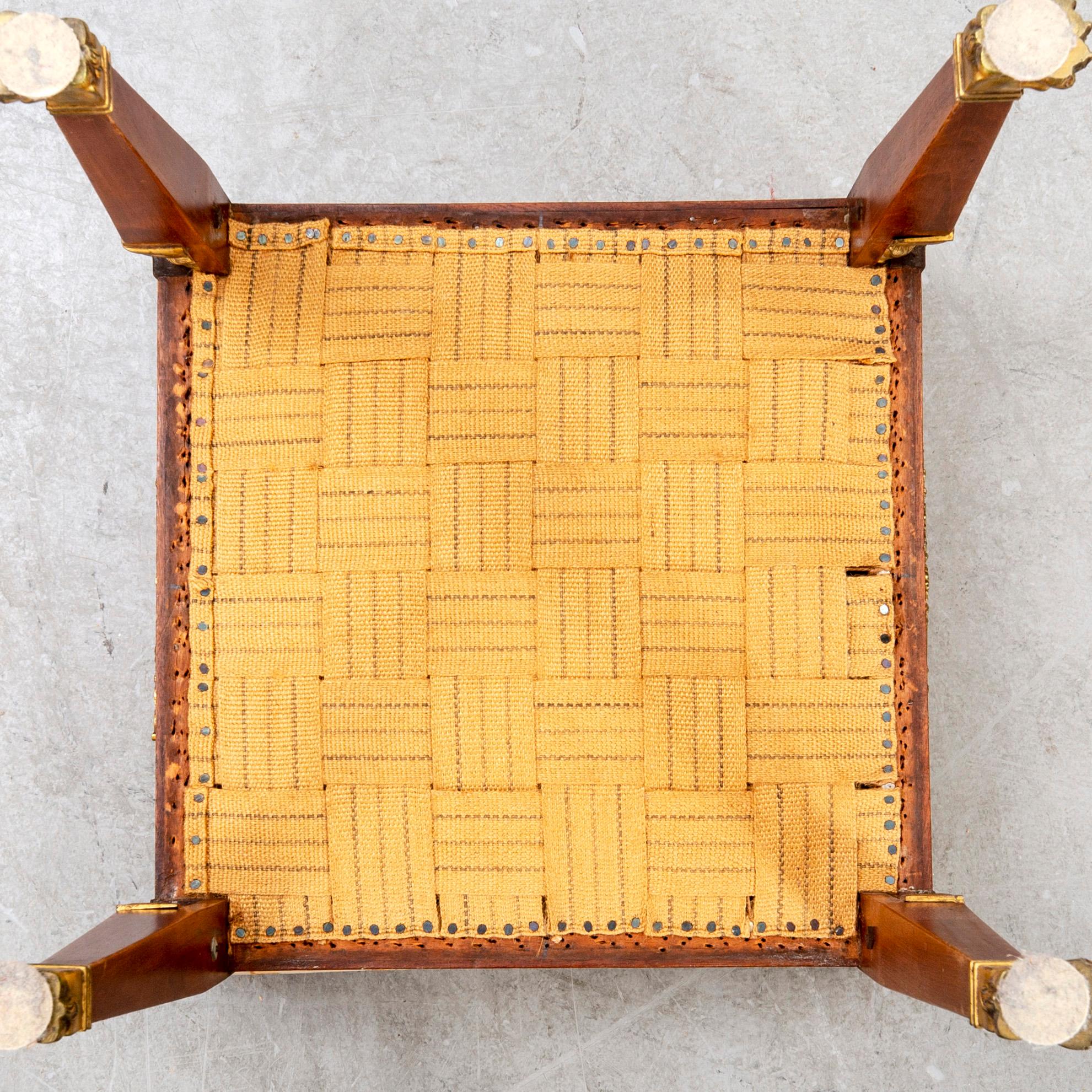 An Empire style mahogany stool around 1900.