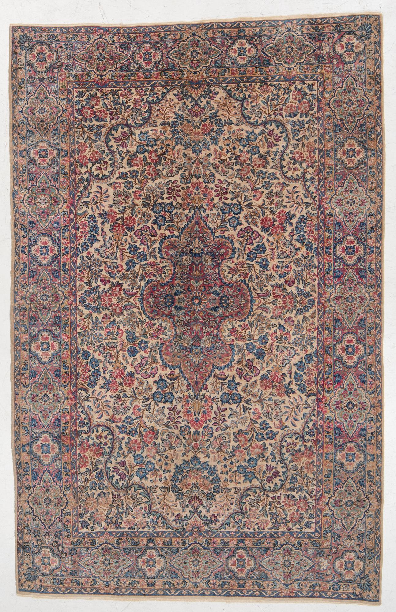 A semi-antique Kerman carpet, c. 273 x 172 cm.