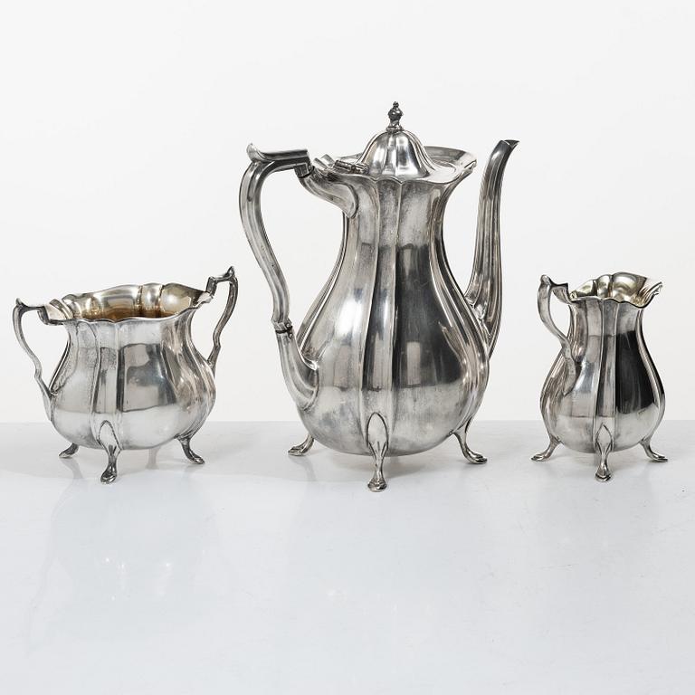Guldsmedsaktiebolaget (GAB), A Swedish Rococo style silver coffee pot, cream jug and sugar bowl, mark of GAB, Stockholm 1918-1919.