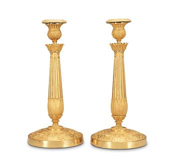 525. A pair of French late Empire first half 19th Century candlesticks.