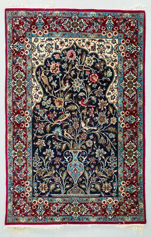 A silk rug from Isfahan. Approx. 166 x 110 cm.