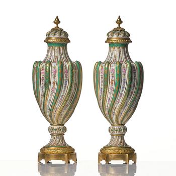 A pair of French 'Sèvres' porcelain urns, 1890s.