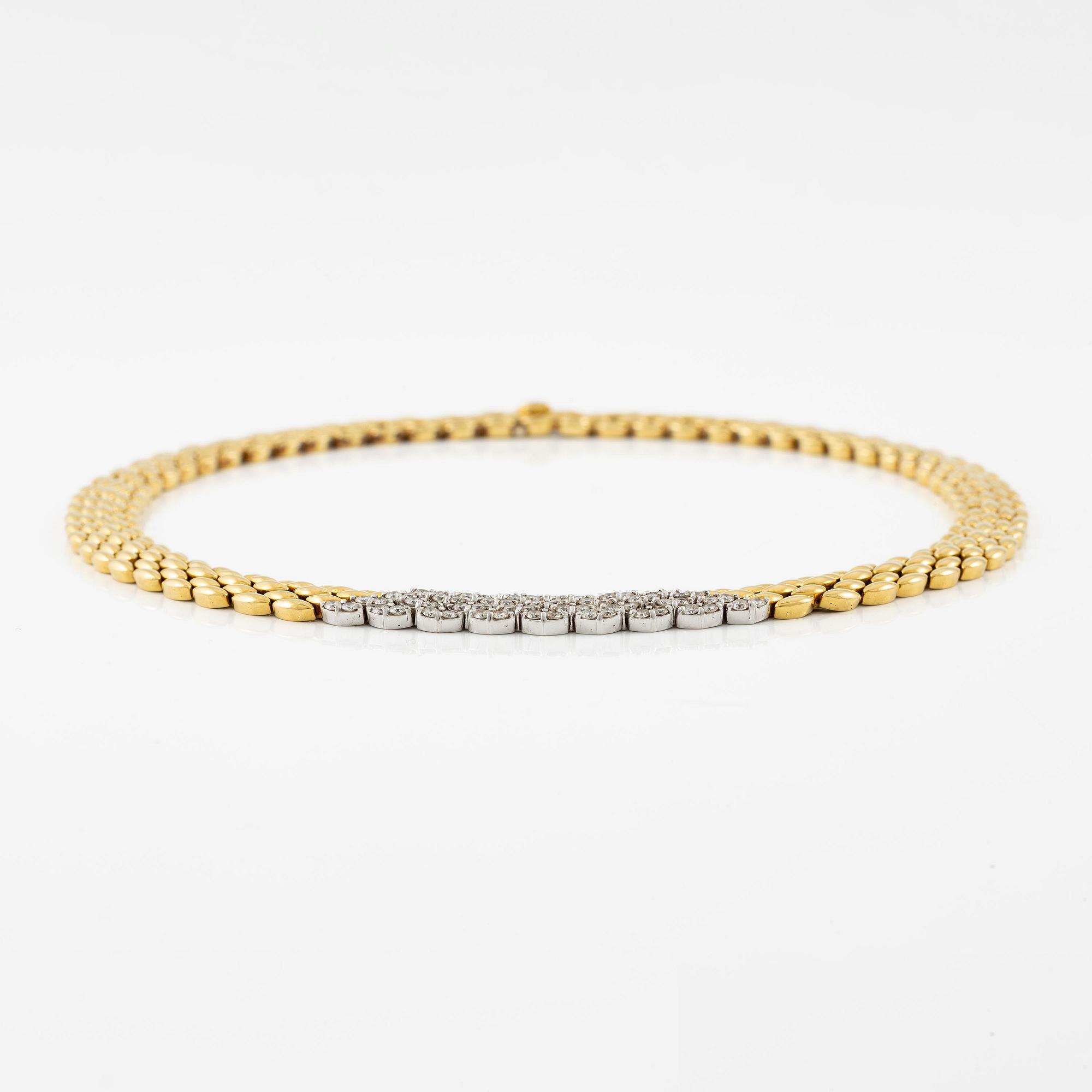 An 18K gold necklace set with round brilliant-cut diamonds.