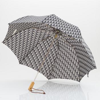 Christian Dior, a black canvas umbrella, toilet bag, coin purse and wallet.